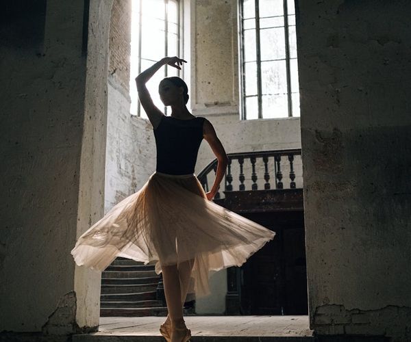 Person practicing slow movements near a window